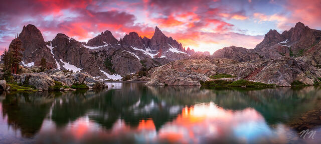 Minaret Lake reflecting jagged Sierra Nevada peaks at sunset in the Ansel Adams Wilderness near Mammoth Lakes, California.